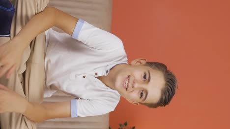 Vertical-video-of-Portrait-of-cheerful-boy.